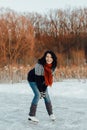 Happy woman ice skating on a frozen lake Royalty Free Stock Photo