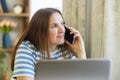 Woman Working from Home on a Phone Call Royalty Free Stock Photo