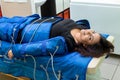 Woman having procedure of anti cellulite massage on pressotherapy machine Royalty Free Stock Photo