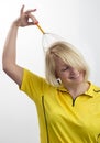Smiling woman with a head massage tool Royalty Free Stock Photo