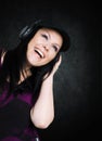 Smiling woman with headphones listening music Royalty Free Stock Photo