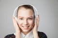 Smiling woman with headphones listening music Royalty Free Stock Photo