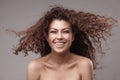 Smiling woman with healthy brown curly hair Royalty Free Stock Photo