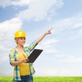 Smiling woman in helmet with clipboard Royalty Free Stock Photo