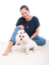 Smiling woman with her fluffy dog Royalty Free Stock Photo