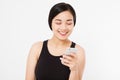 Smiling woman hold cellphone. Closeup young happy beautiful asian japanese woman. Girl looking at mobile cellphone isolated on whi Royalty Free Stock Photo