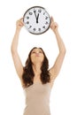 Smiling woman holding big clock. Royalty Free Stock Photo