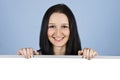 Smiling woman holding a blank banner Royalty Free Stock Photo