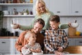 smiling woman holding bowls near husband Royalty Free Stock Photo