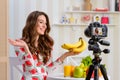 Smiling woman holding bananas Royalty Free Stock Photo