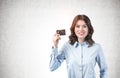 Smiling woman holding credit card, mock up Royalty Free Stock Photo