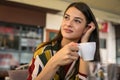 Smiling woman holding cup of coffee. Royalty Free Stock Photo