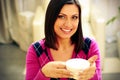 Smiling woman holding cup of coffee Royalty Free Stock Photo