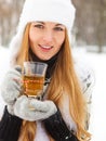 Smiling woman holding cup of tea in her hands Royalty Free Stock Photo