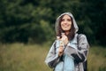 Smiling Woman Holding Dandelion Flowers Enjoying Rain Season