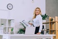 smiling woman holding documents