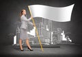 Smiling woman holding flagpole with white flag Royalty Free Stock Photo