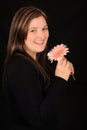 Smiling woman holding flower Royalty Free Stock Photo