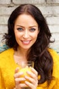 Smiling woman holding glass of orange juice Royalty Free Stock Photo