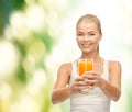 Smiling woman holding glass of orange juice Royalty Free Stock Photo