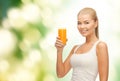 Smiling woman holding glass of orange juice Royalty Free Stock Photo