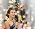 Smiling woman holding glass of sparkling wine Royalty Free Stock Photo