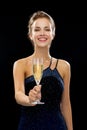 Smiling woman holding glass of sparkling wine Royalty Free Stock Photo