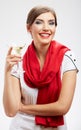 Smiling woman holding martini glass with alcohol.