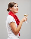Smiling woman holding martini glass with alcohol.