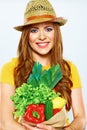 Smiling woman holding paper bag with green vegan food Royalty Free Stock Photo