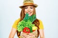 Smiling woman holding paper bag with green vegan food Royalty Free Stock Photo