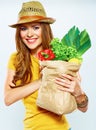 Smiling woman holding paper bag with green vegan food Royalty Free Stock Photo