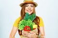 Smiling woman holding paper bag with green vegan food Royalty Free Stock Photo