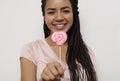 Smiling woman holding pink heart Royalty Free Stock Photo