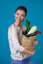 Woman holding a shopping bag full of groceries Royalty Free Stock Photo