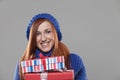 Smiling Woman Holding Stack of Christmas Presents Royalty Free Stock Photo