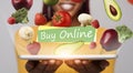 Smiling woman holding tablet with flying fruits and vegetables with text