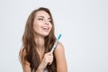 Smiling woman holding toothbrush