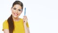 Smiling woman holding toothy brush. Isolated studio portrait. Royalty Free Stock Photo