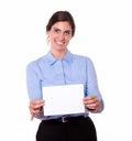 Smiling woman holding up a blank white card Royalty Free Stock Photo