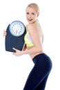 Smiling woman holding a waight scale Royalty Free Stock Photo