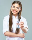 Smiling woman holding water glass. Isolated portrait of young m Royalty Free Stock Photo