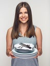 Smiling woman holding white crockery set Royalty Free Stock Photo