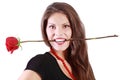 Smiling woman holds red rose between her teeth Royalty Free Stock Photo