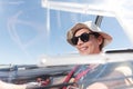 smiling woman inside glider cockpit Royalty Free Stock Photo