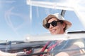 smiling woman inside glider cockpit Royalty Free Stock Photo