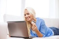 Smiling woman with laptop computer and credit card Royalty Free Stock Photo