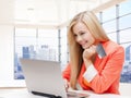 Smiling woman with laptop computer and credit card Royalty Free Stock Photo