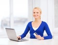 Smiling woman with laptop computer and credit card Royalty Free Stock Photo