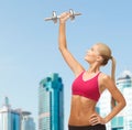 Smiling woman lifting steel dumbbell Royalty Free Stock Photo